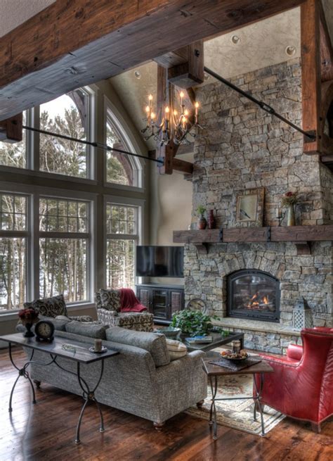 It includes a chevron fireplace framed with a wooden mantel that's fixed to the beige pillar. 15 Warm & Cozy Rustic Living Room Designs For A Cozy Winter