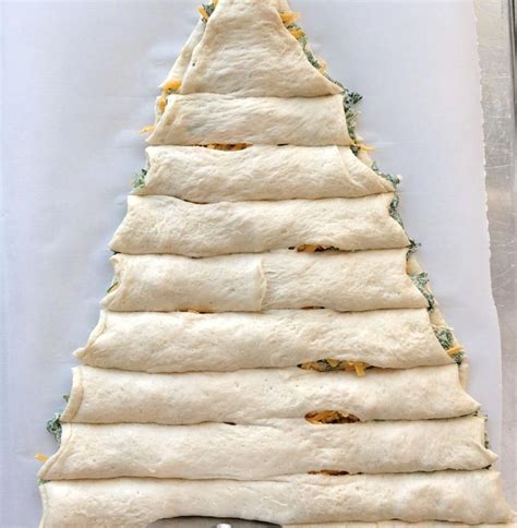 The refrigerated pizza dough from a tube that i used may not hold up well to sitting in the fridge for a few hours before baking. Christmas tree spinach dip breadsticks - It's Always ...