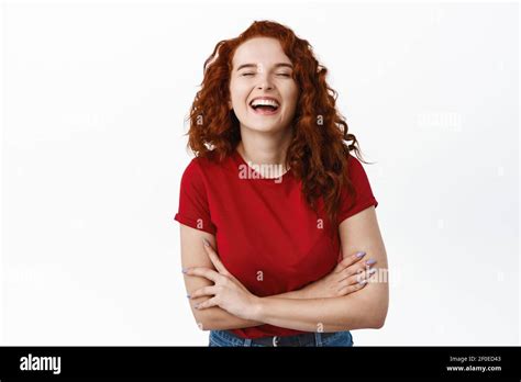 Happy Redhead Girl With Curly Hair Laughing Positive With Eyes Closed