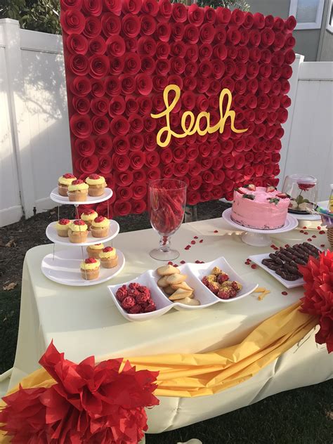 belle birthday theme party yellow and red decorations simple dessert table set up backdrop
