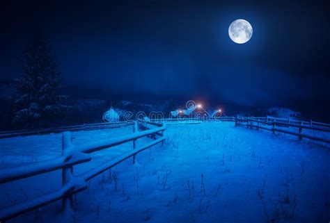 Full Moon Over The Village Covered With Fresh Snow Stock Photo Image