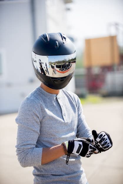 Free Photo Vertical Shot Of A Person Wearing A Motorcycle Helmet