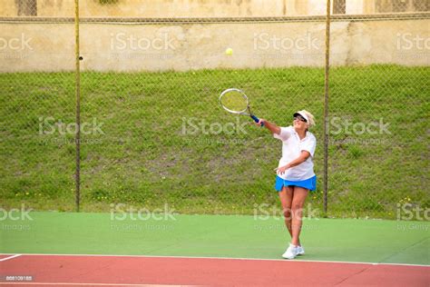 Senior Tennis Player Serving Stock Photo Download Image Now 60 69