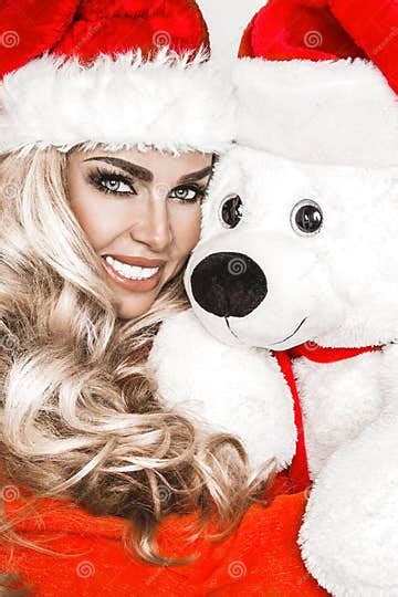 beauty christmas fashion model girl with white teddy bear long straight blonde hair in red
