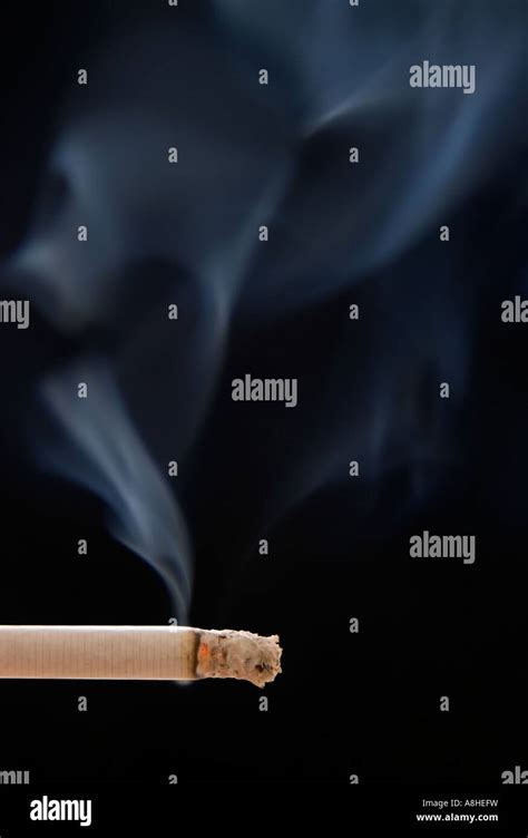 Smoke Coming Out Of Cigarette Making Ghosts Figures Stock Photo Alamy