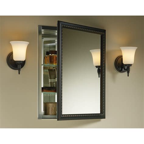 It has an oval shape, and its door is a mirror. Kohler 20" x 26" Wall Mount Mirrored Medicine Cabinet with ...