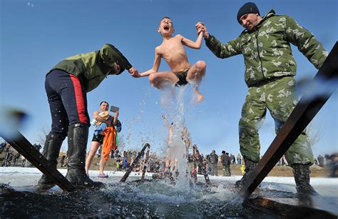 Russian Orthodox Epiphany Christians Plunge Into Frozen Rivers