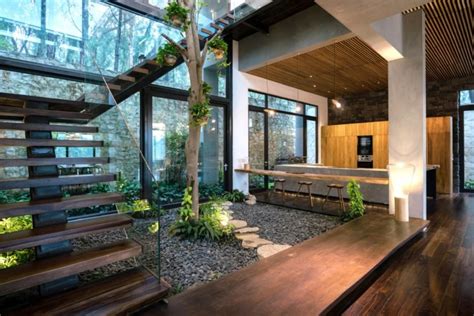 nature inspired teak house welcomes vietnams forests indoors