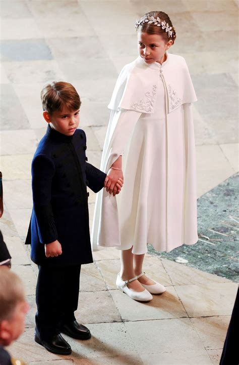 Princess Charlotte Sweetly Holds Her Brother Prince Louiss Hand At The