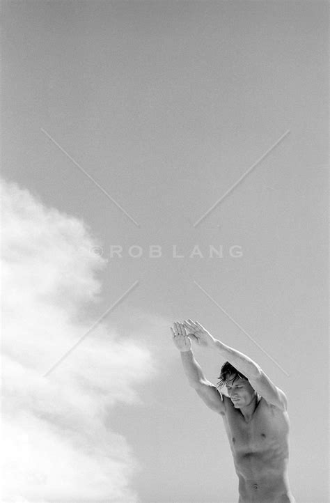 Man Without Clothes Diving Into A Cloud Rob Lang Images