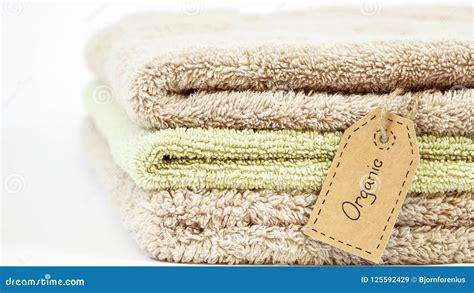 Pile Of Organic Cotton Bath Towels On White Background Stock Image