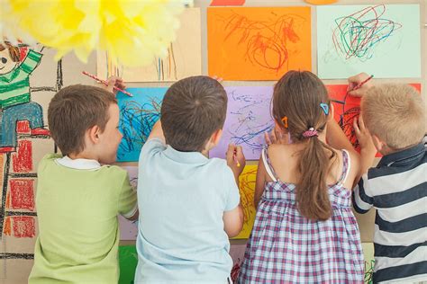 Preschoolers Drawing On The Wall By Stocksy Contributor Lumina
