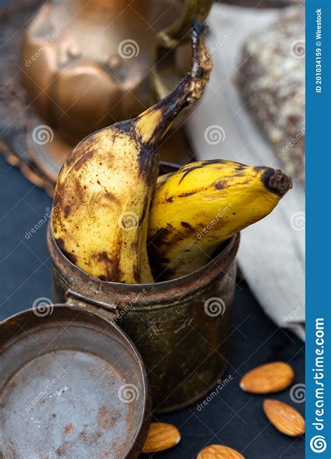 Vertical Closeup Shot Of Old Bananas In A Rusty Can Stock Image Image