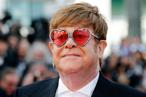 The terminator finds some sunglasses that aren't his style. Elton John Flaunts His Gucci | VisionPlus Magazine
