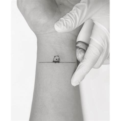 Tiny Panda Bear Tattoo On The Inner Wrist