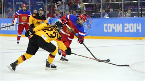 Face of dutch women's hockey. Fighting for the puck in ice hockey at the Olympic Games ...