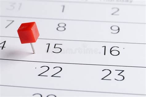 Red Pin On A Date On A Calendar Closeup Important Date Stock Photo