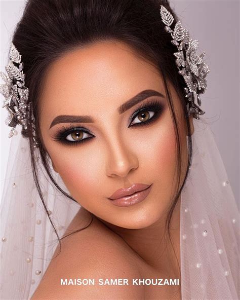 A Woman Wearing A Bridal Veil And Makeup