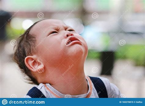 Angry Caucasian Little Baby Boy Crying And Looking Up Stock Image