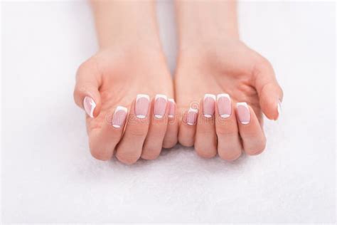 Beautiful Female Hands With French Manicure On White Stock Image