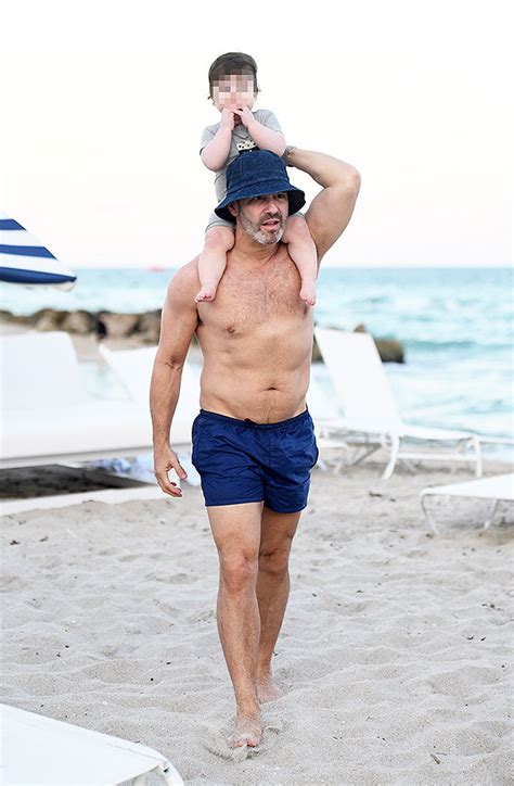 andy cohen reveals toned abs while on vacation with son benjamin hollywood life