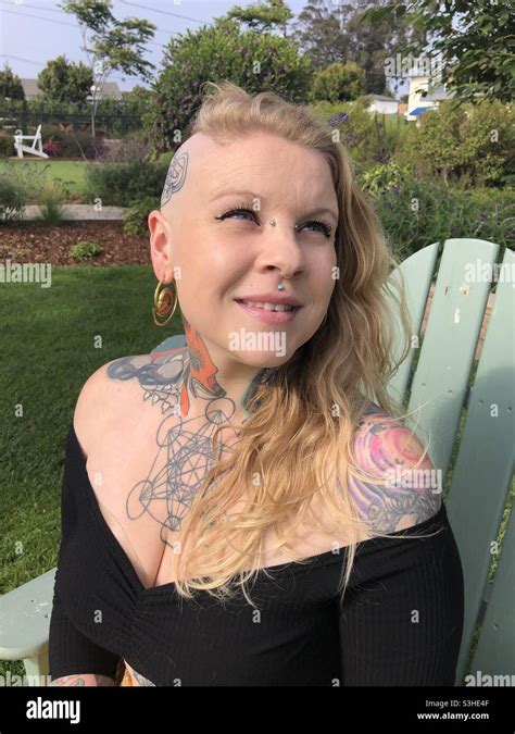 Beautiful Young Woman Expressing Herself With Tattoo Art And Piercings