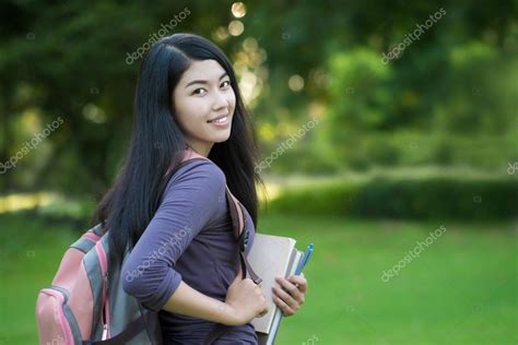 Asian College Student On Campus In Park — Stock Photo © Wichansumalee