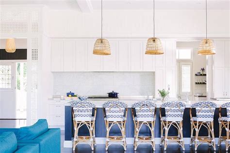 Rattan bar chairs in white kitchen. Blue Kitchen Island with Serena and Lily Riviera Backless ...
