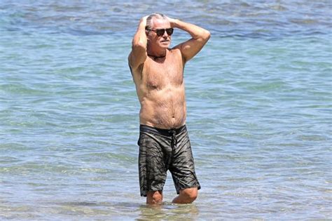 68 year old pierce brosnan looks topless in hawaii photos e news uk