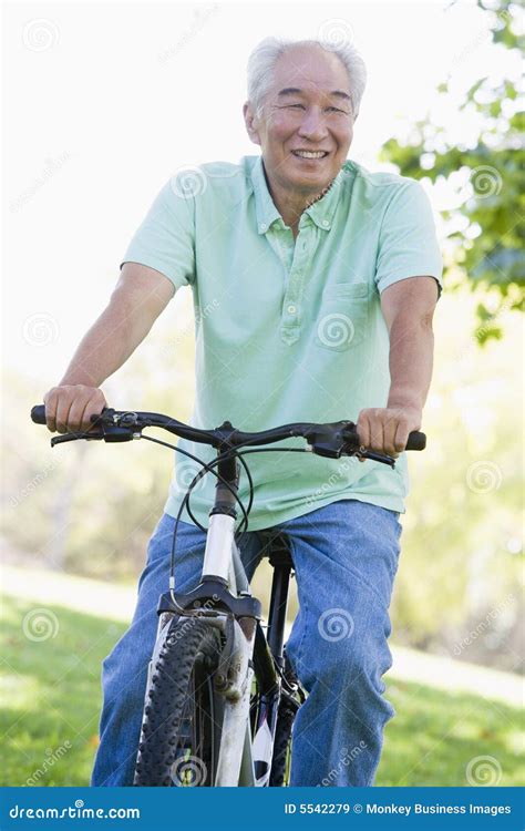 Man On Bike Outdoors Smiling Stock Image Image Of Boomer Active 5542279