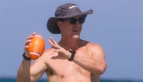peyton manning flaunts ripped abs while shirtless at the beach photos ashley thompson