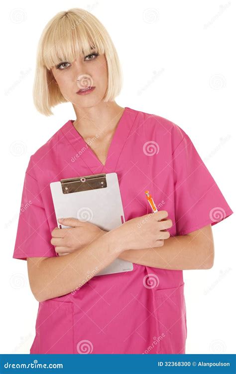 Nurse In Pink Scrubs Holding Notepad Stock Photo Image Of Blond