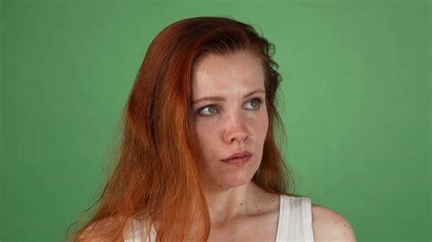 Studio Portrait Of A Young Red Haired Woman Looking Angry Ginger