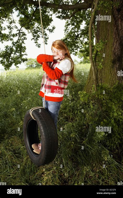Little Girl Swing On Tire High Resolution Stock Photography And Images