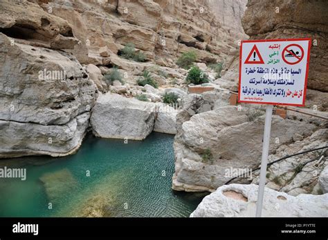 Sultanate Of Oman Wadi Shab A Sign Written In Arabic Warn About The
