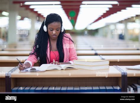 Female Student Studying In Library Stock Photo Alamy