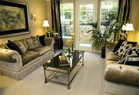 Brown is the color for security and stability and it is also a sophisticated color. Black Gold And Cream Living Room Ideas Gold Brown Living Room Gold Living Room Decor Combina ...