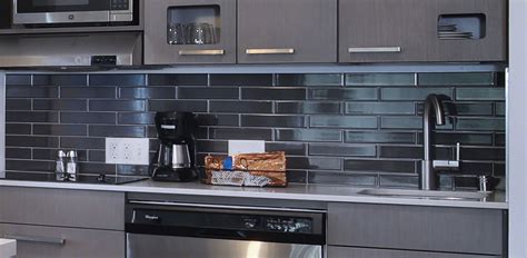Create beautiful and durable quartz countertops, kitchen islands, floors, accent walls, showers, and others throughout residential and commercial properties. Commercial Room Scene | Countertop Cashmere Carrara Quartz