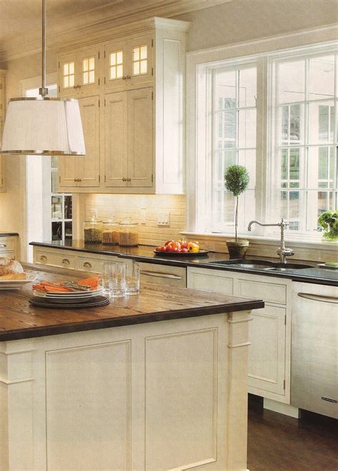 Complementary granite counters for white cabinets. design dump: white kitchen + wood countertops