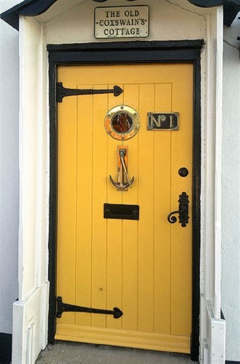 Here's a front entry door with large glass window with iron decor included. Nautical Knick-Knacks | Nautical Handcrafted Decor Blog