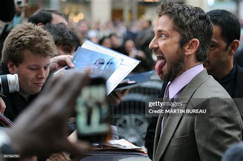 Scottish Actor Gerard Butler Sticks The Tongue Out As He Arrives On