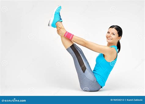 Smiling Woman Doing Stretching Pilates Exercises At The Gym Stock Image