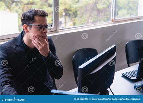 Man With Computer With Doubt Face Blond Caucasian Man Who Works In An