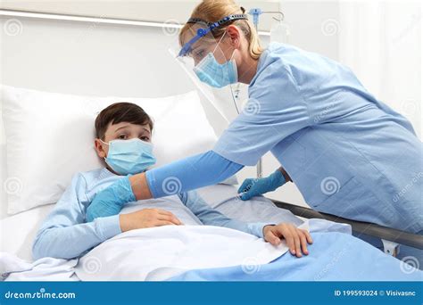 The Nurse Takes Medical Instruments From The Ultraviolet Cabinet For