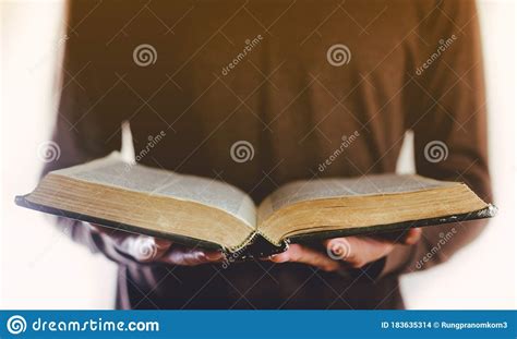 Hands Holding The Open Bible Stock Photo Image Of Background