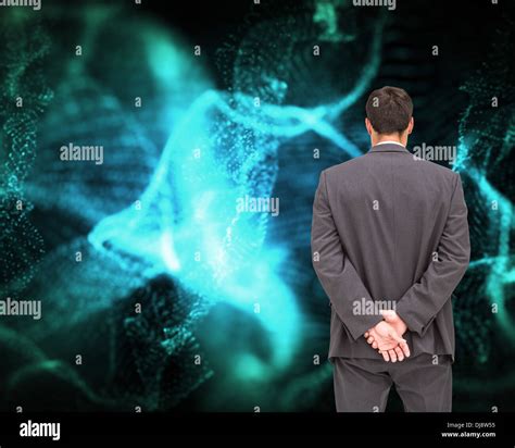 Businessman Standing With Hands Behind Back Stock Photo Alamy