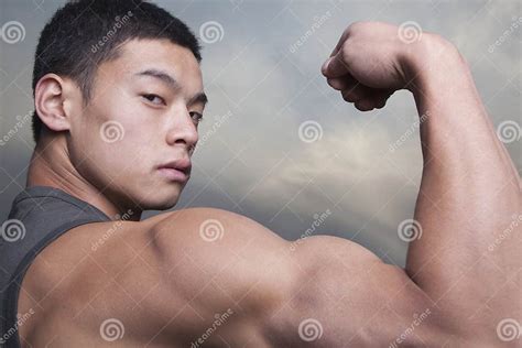 Young Man Showing Off His Bicep Muscles Stock Image Image Of Body
