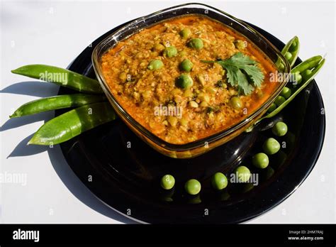 fresh green peas dal pulses in bowl hare matar ki daal garnished with peas seed and coriander