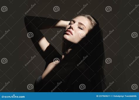 portrait of beautiful woman model looking seductive and sensual sensual girl with art shadow