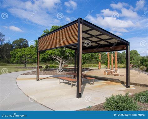 Modern Pergola And Sitting Area With Play Ground Behind In Public Park